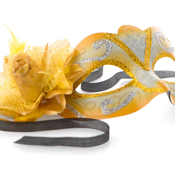 Yellow venetian mask for a party on a white background
** Note: Shallow depth of field
